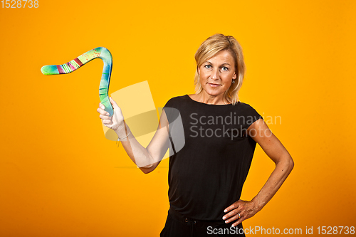 Image of woman posing with a boomerang