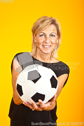Image of woman posing with a soccer ball