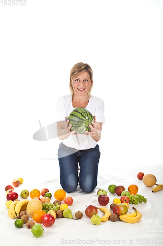 Image of Fruits and blond cute woman