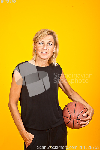 Image of woman posing with a basket ball