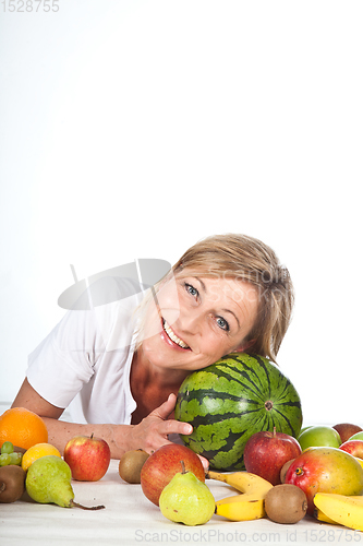 Image of Fruits and blond cute woman