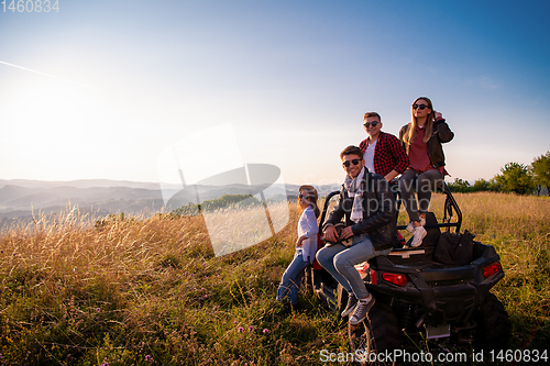 Image of group of young people driving a off road buggy car