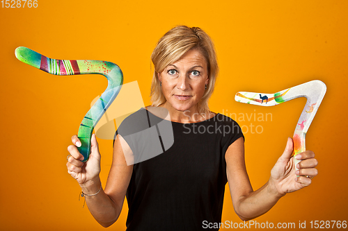 Image of woman posing with a boomerang
