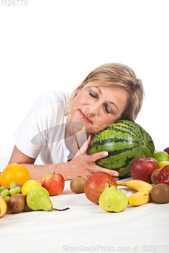 Image of Fruits and blond cute woman