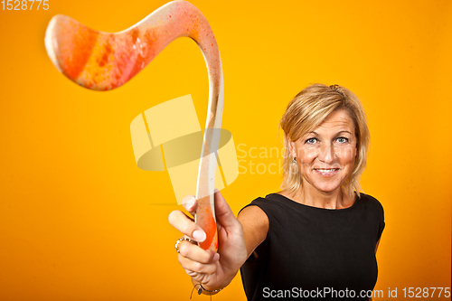 Image of woman posing with a boomerang