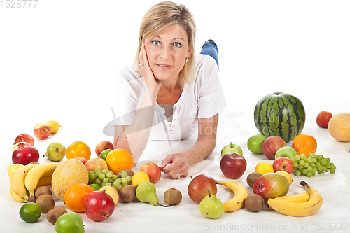 Image of Fruits and blond cute woman