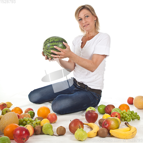 Image of Fruits and blond cute woman