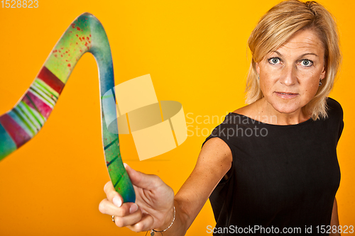 Image of woman posing with a boomerang