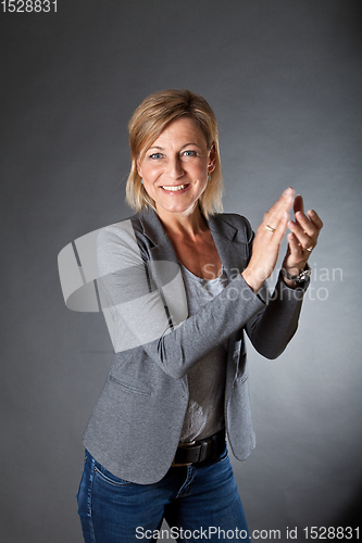 Image of woman portrait clapping hands