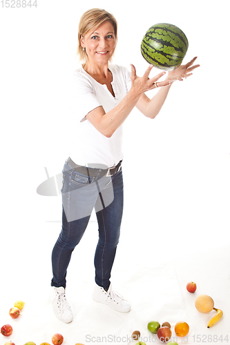 Image of Fruits and blond cute woman