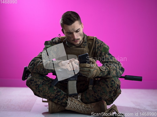 Image of soldier using smartphone