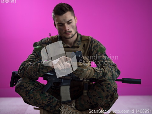 Image of soldier using smartphone