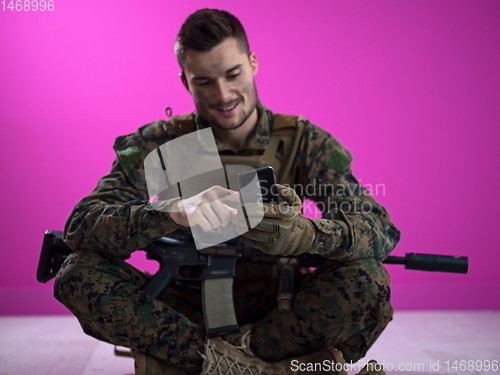 Image of soldier using smartphone