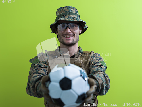 Image of solder holding soccer  ball