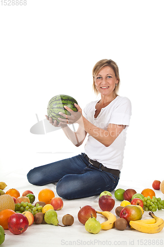 Image of Fruits and blond cute woman