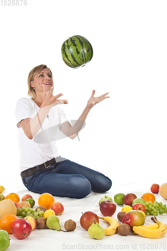 Image of Fruits and blond cute woman