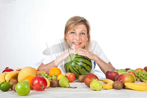 Image of Fruits and blond cute woman