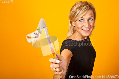 Image of woman posing with a boomerang