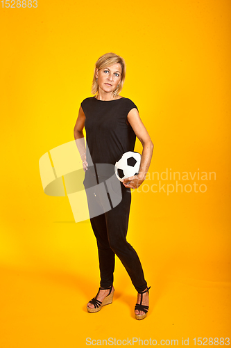 Image of woman posing with a soccer ball