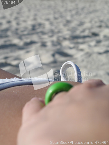 Image of female in a white bikini on the beach