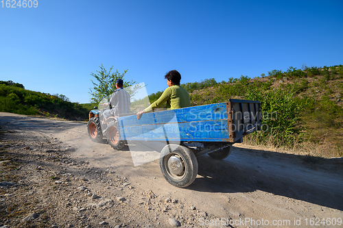 Image of Mini tractor with passengers at dirt mountain road at Northern Moldova