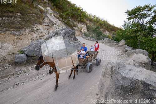 Image of Traditional horse cart at dirt mountain road at Northern Moldova