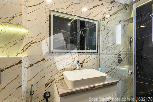 Image of Spacious bathroom in black and white tones