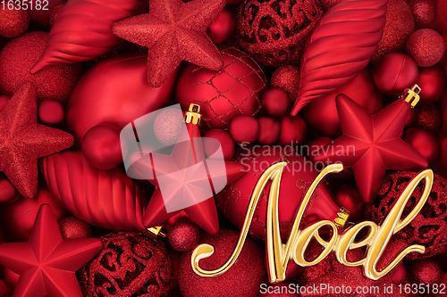 Image of Gold Noel Sign and Red Bauble Background