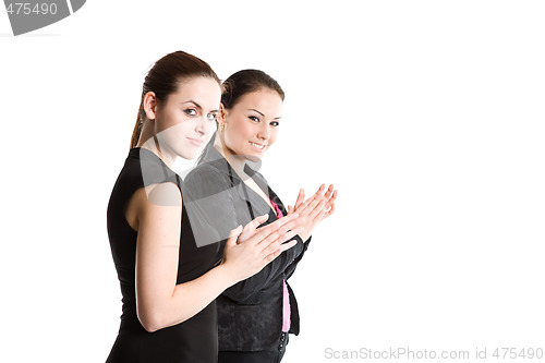 Image of Two businesswomen clapping hands