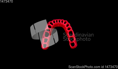 Image of model of human gums without teeth isolated on black