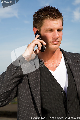 Image of Caucasian businessman on the phone