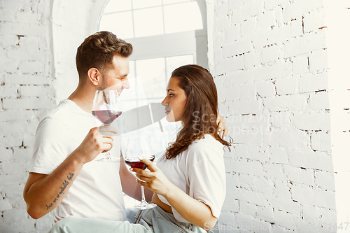 Image of Young couple moved to a new house or apartment