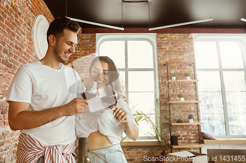 Image of Young couple moved to a new house or apartment