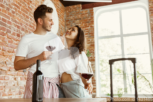 Image of Young couple moved to a new house or apartment