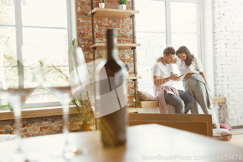 Image of Young couple moved to a new house or apartment