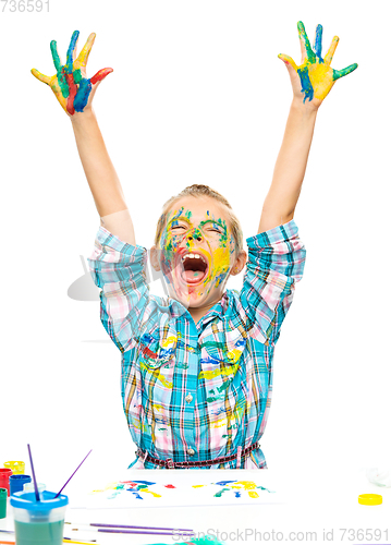 Image of Little girl is rising her hands up in joy