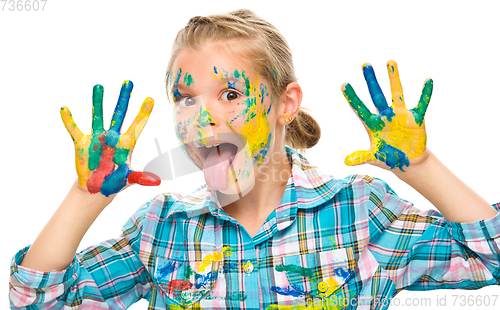 Image of Portrait of a cute girl playing with paints