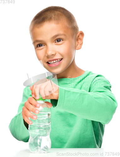 Image of Boy with plastic bottle of water