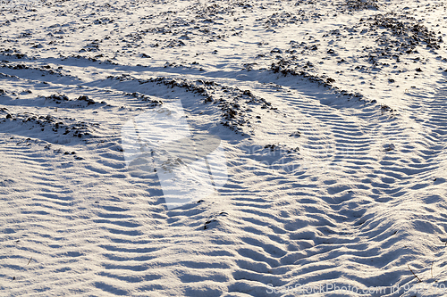 Image of traces of the car wheels on snow