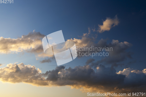 Image of clouds of white and gray in the sunlight close-up