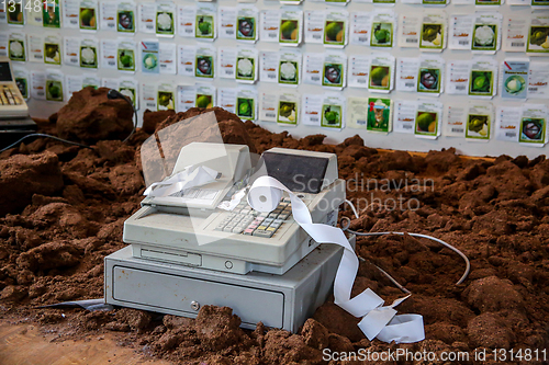 Image of Old cash register with cash register tape. 