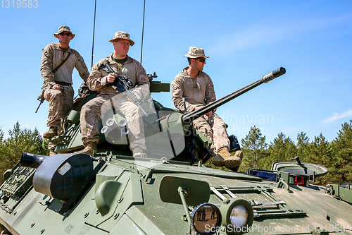 Image of Soldiers on tank in military training Saber Strike in Latvia.