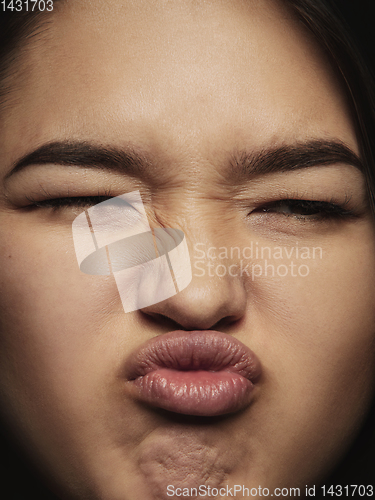 Image of Close up portrait of young emotional woman