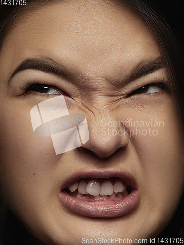 Image of Close up portrait of young emotional woman