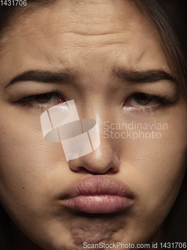 Image of Close up portrait of young emotional woman