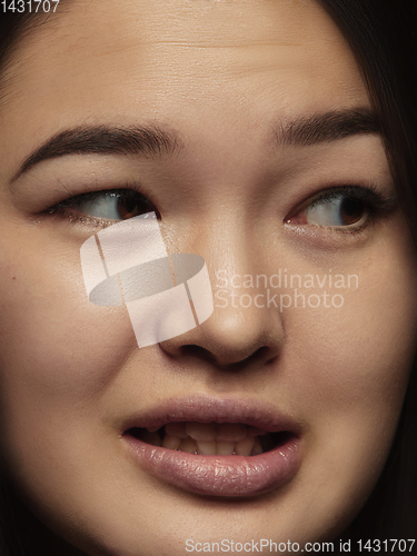 Image of Close up portrait of young emotional woman