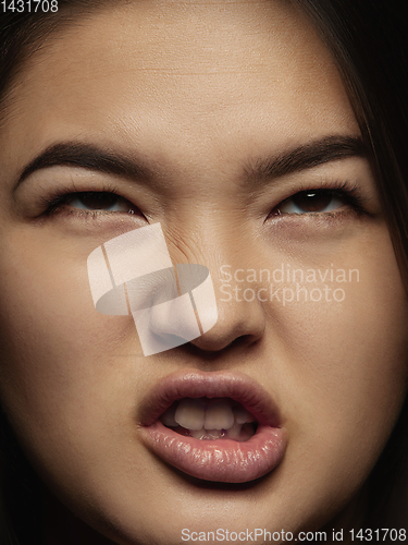 Image of Close up portrait of young emotional woman