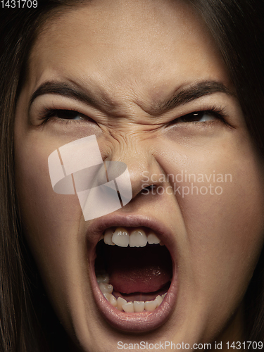 Image of Close up portrait of young emotional woman