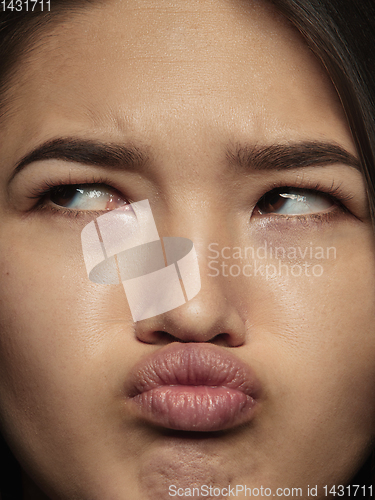 Image of Close up portrait of young emotional woman