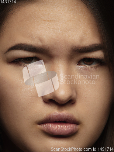 Image of Close up portrait of young emotional woman